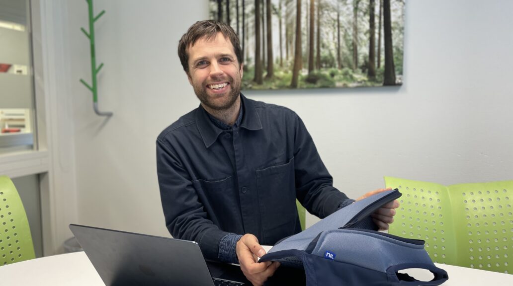 Martin Hanberger sitting in an office, showcasing the Nil Medical Vestpack.