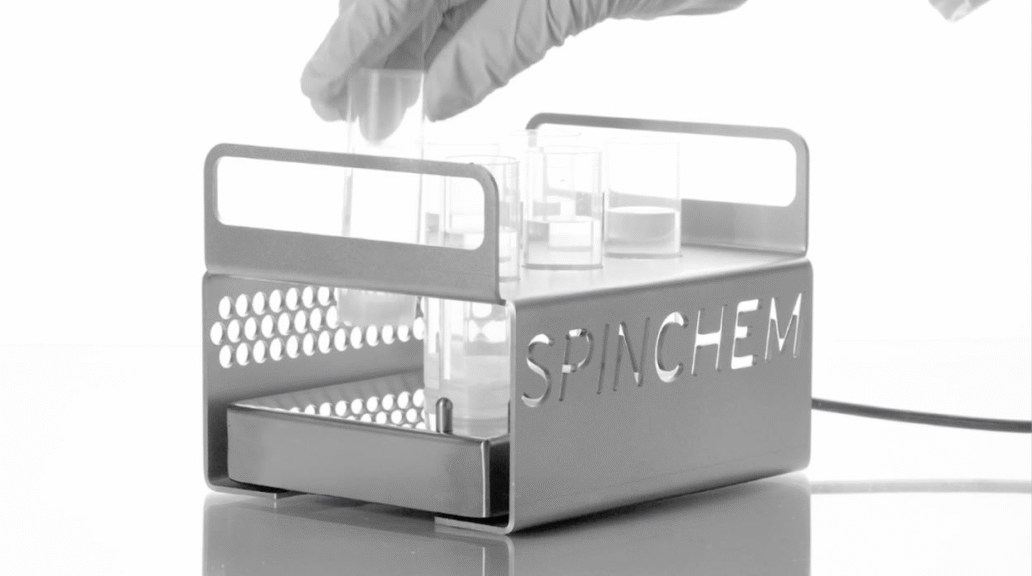 A rack, with Spinchems name on it, with small test tubes.