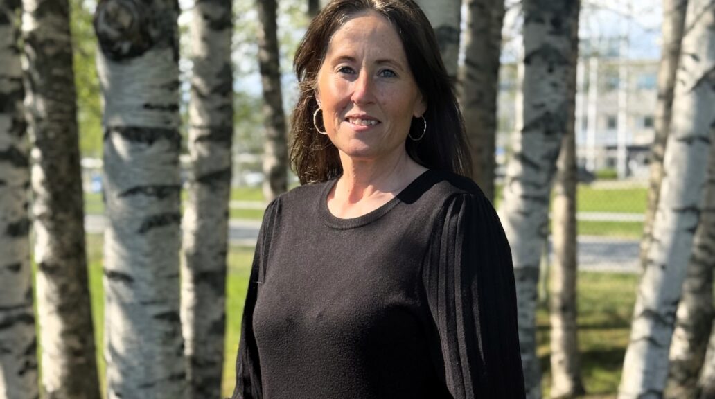 A portrait picture of Sofia, wearing a black sweater